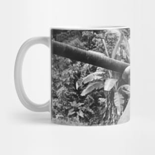 young man using blowgun Mug